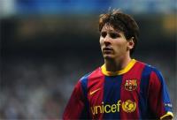 Footballer in Barcelona kit, focused on the match