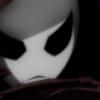 Ghostly pale mask emerging from shadowy darkness