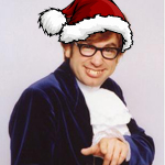 Santa hat photoshopped onto a smiling guy in glasses
