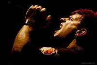Passionate singer captured mid-performance under stage lights
