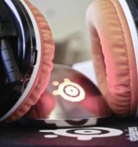 Close-up of SteelSeries gaming headphones with orange cushions