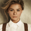 Portrait-style avatar with a windswept, artistic look