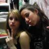 Two friends flashing peace signs in an old candid pic