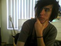 Emo-era webcam selfie, straight from a forum avatar