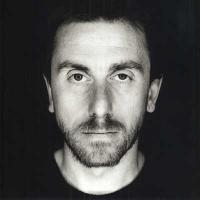 Grainy black-and-white portrait, a face from the archives
