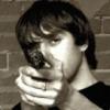 Guy pointing a gun at the camera, classic forum avatar