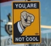 Classic pointing-finger 'you are not cool' meme sign