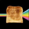 Toast riding a rainbow through space, peak internet meme energy