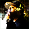 Member avatar smoking with cap and green glow