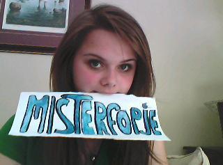Member verification pic holding handwritten forum name sign